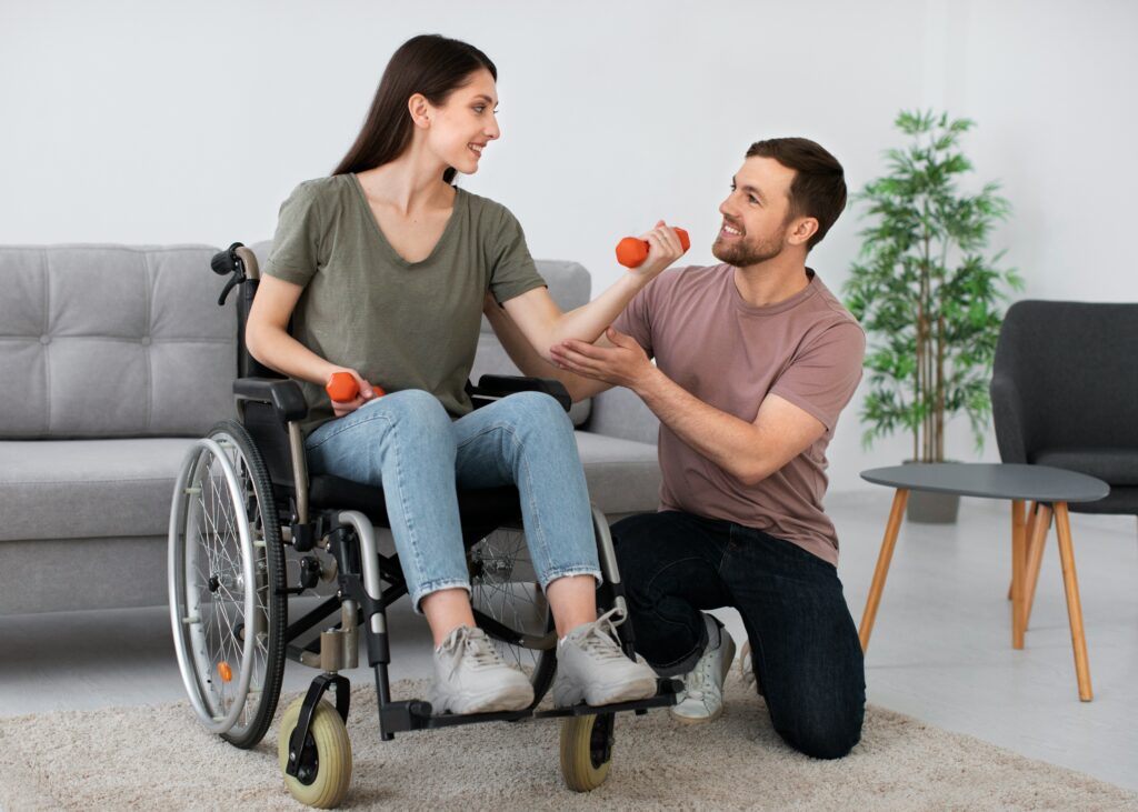 Couple with woman in wheelchair lifting weights | Atlanta home modifications for accessibility
