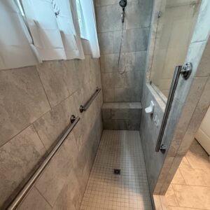 Grab bars blend naturally with the overall bathroom design.